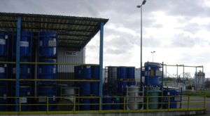 Industrial chemical drums at a storage site