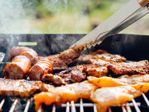 Chicken pieces cooking on a grill